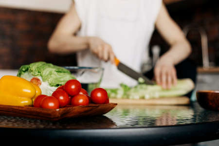 Fresh vegetables on the kitchen table for healthy food preparationの写真素材