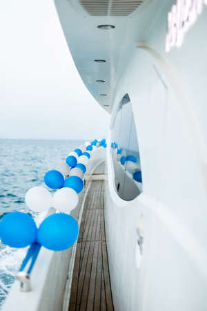 The exterior of a luxury yacht decorated with balloons. Event, holiday, birthdayの写真素材