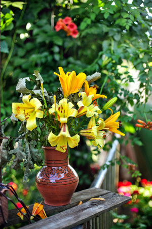 yellow flowers in vaseの写真素材