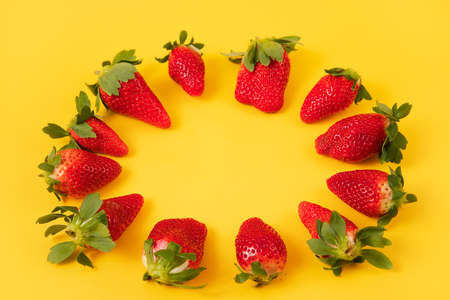 red Strawberries on the green backgroundの写真素材