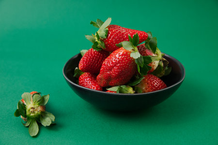 red Strawberries on the green backgroundの写真素材