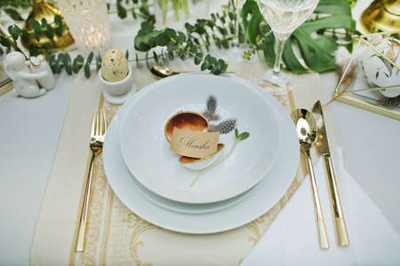 beautiful and cozy bright easter table decorationの写真素材