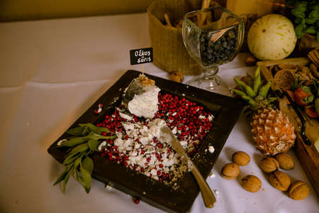 celebration table decoration with flowers candles fruits at the restaurantの写真素材