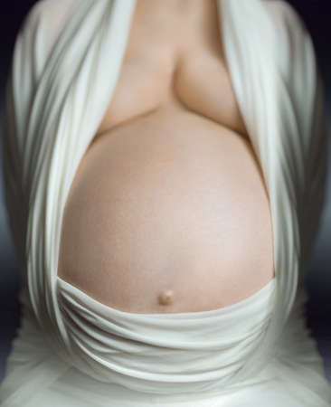 pregnant women waiting for the new baby life, holding hand on the bellyの写真素材