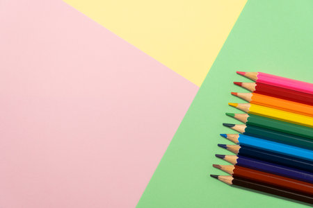 Color pencils on background of colored paper. Education or kids creativity concept.の写真素材