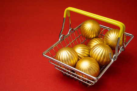 Shopping basket with christmas tree balls or baubles.の写真素材