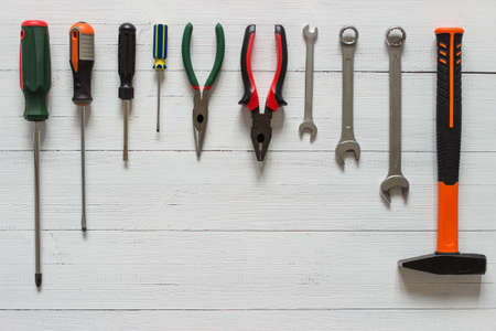 Kit of construction tools and instruments on wood texture background. Copy space.の写真素材