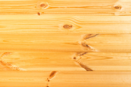 Background. Wooden boards of natural color (pine) with texture and knotsの写真素材