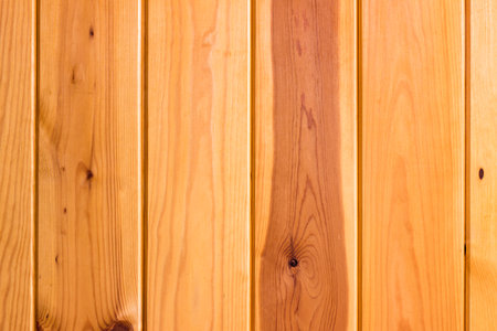 Natural wood texture for background. Vertical wooden boards with knots and wood structure.の写真素材
