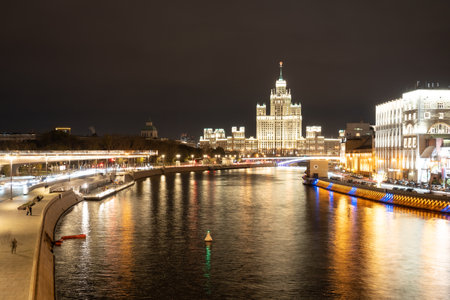 Night landscape of the center of Moscow with a view of the high-rise on the Kotelnicheskaya embankment, the Floating bridge of Zaryadye Park and the Moscow river. City in night illumination.のeditorial素材