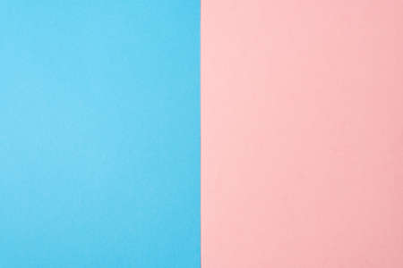 Background of two vertical rectangles blue and pink. Sheets of blank blue and pink paper split vertically.の写真素材