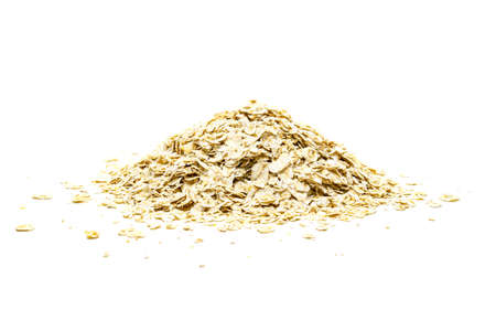 Heap of oat flakes on whiteの写真素材