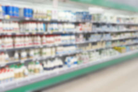 Abstract blurred refrigerator with dairy products in supermarket for background.の写真素材