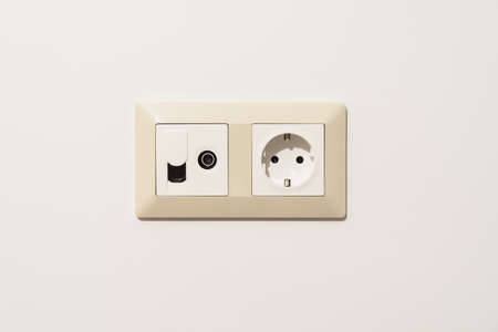 Sockets on white wall. Multifunction outlet with internet connection, tv and electric socket plug...