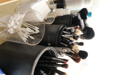 Set of makeup brushes in glass container. Beauty and fashion accessories for professional makeup and cosmetic care.の写真素材