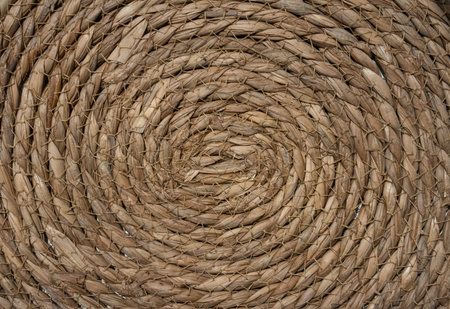 Natural rope twisted into a round shape. Texture for design, eco concepts and backgrounds.