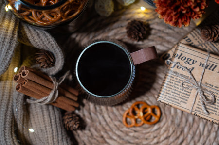 Black coffee with rustic autumn decor and cookies. Cozy seasonal lifestyle flat lay for hygge moodの写真素材