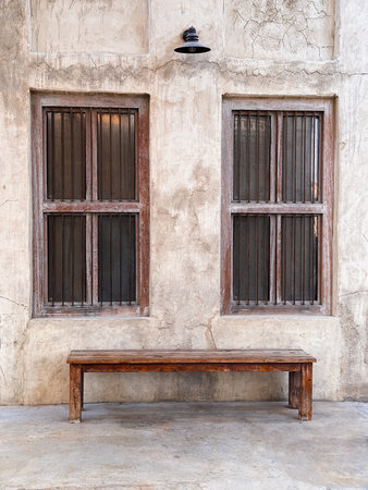 Minimal rustic composition with an old bench placed by vintage windows. Perfect for architectural,...