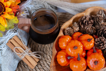 Autumn harvest composition with pumpkins, dry flowers, and rustic rope, perfect for fall holiday and seasonal design projects.の写真素材