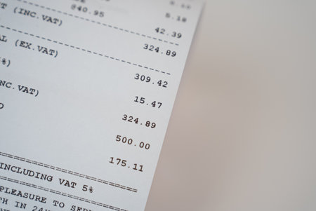 A printed expense receipt. Concept of personal budget, cost tracking, and economy.の写真素材