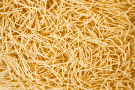 Thin vermicelli noodles on white background with text space. Great for Italian cuisine, recipe designs, and product advertising.の写真素材