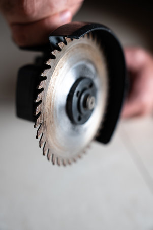 Vertical product shot of a circular blade mounted on a grinder. Optimized for thumbnails, banners,...