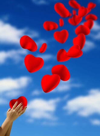 Heart fly into the sky from the handsの写真素材