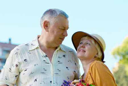 men and women smiling in the parkの写真素材