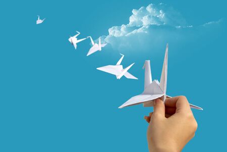 hand launch into the sky paper pigeonの写真素材