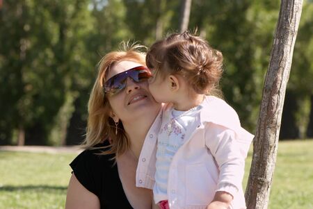 Mother and daughter in the park in summerの写真素材