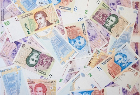 Background of different Argentinean pesos of ten five twenty two and hundred billsの写真素材