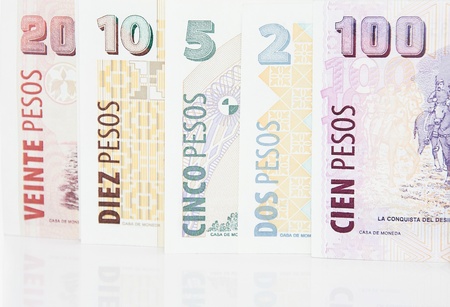 Background of different Argentineans pesos of ten five twenty two and hundred billsの写真素材