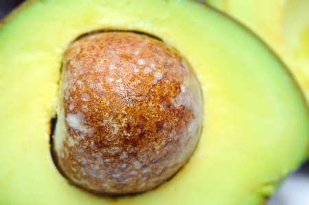Fresh tropical avocado pear fruit, healthy food on white, macro close up over white 