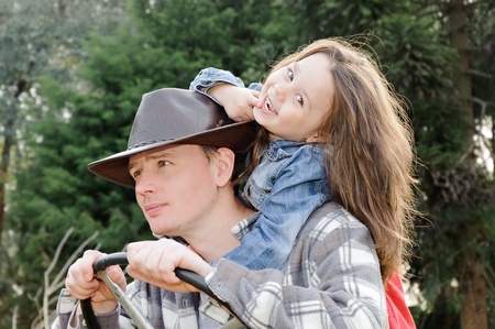Portrait of father with little daughter outdoor in summer parkの写真素材