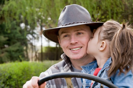 happy family, his father kisses daughterの写真素材