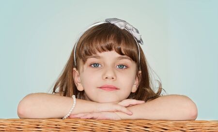 Beautiful Little Girl Posing for Camera in Studioの写真素材