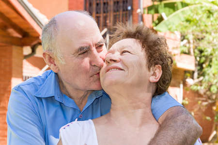Happy senior woman and man enjoying in the park.の写真素材