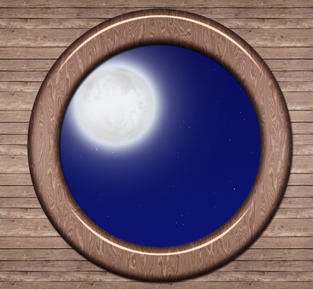 porthole with a nightly sky and moonの写真素材