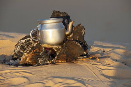 Tea making in Sahara desert in Egypt, sunsetの写真素材