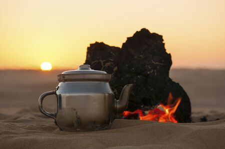 Tea making in Sahara desert in Egypt, sunsetの写真素材