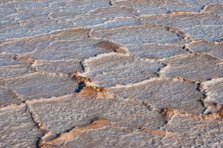 Salt, environment erosion problem, dry salty field texture backgroundの写真素材
