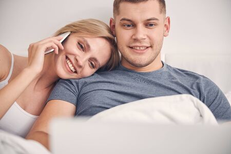 Smiling family couple staying together and looking happyの写真素材