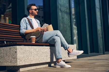 Positive delighted male person enjoying warm day