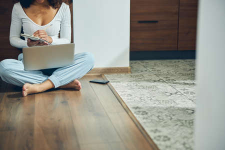 Woman jotting down her ideas in a notebook