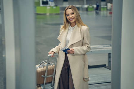 Amazing blonde female preparing for her flightの写真素材