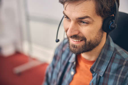 Handsome male worker looking away and smiling