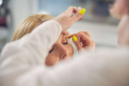 Close up of female hands that doing makeup