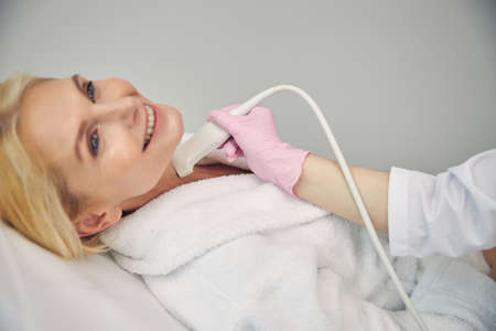 Positive delighted elderly patient visiting her doctor