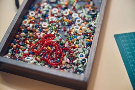 Various jewelry elements placed together in containerの写真素材