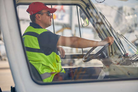Man in a car looking in front of him
